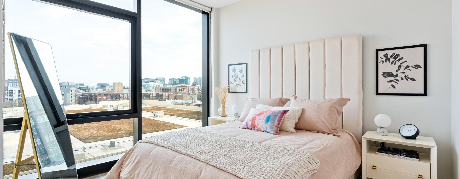 a bedroom with a large window