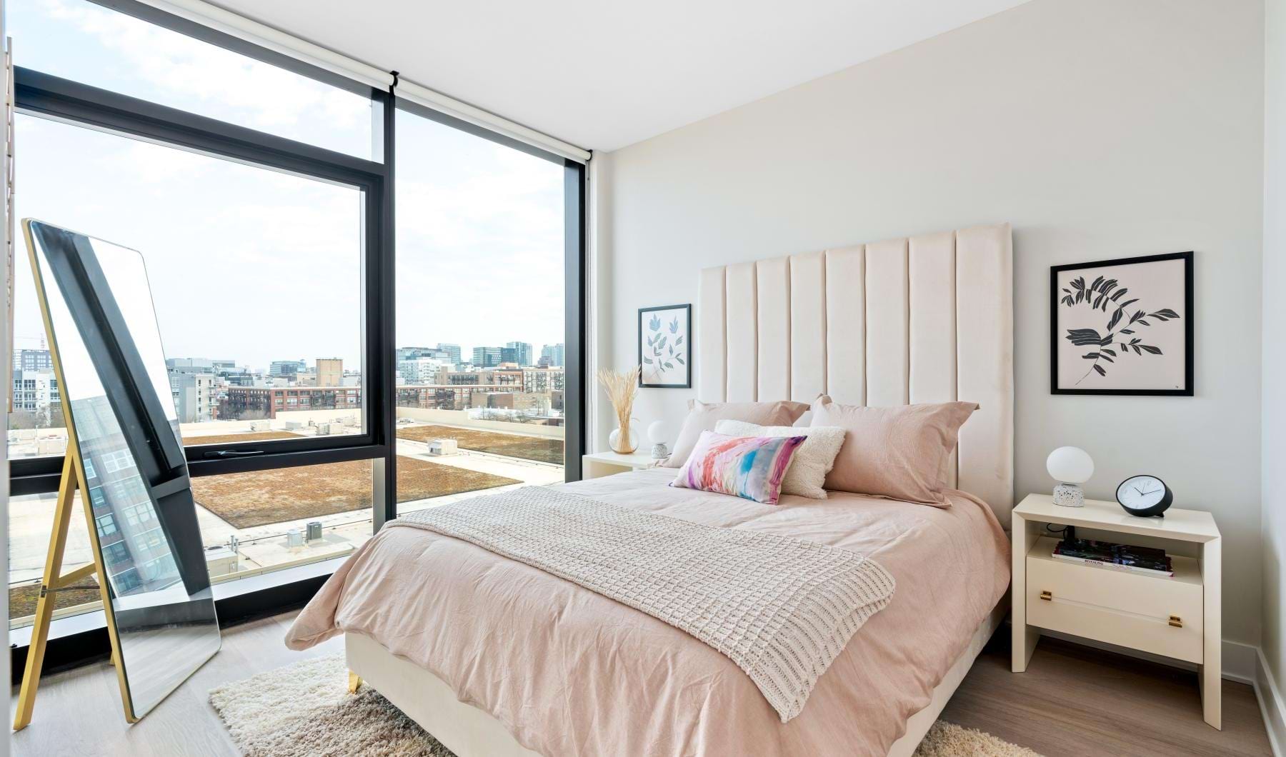 a bedroom with a large window